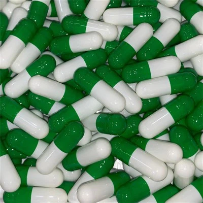 Cápsulas verdes y blancas